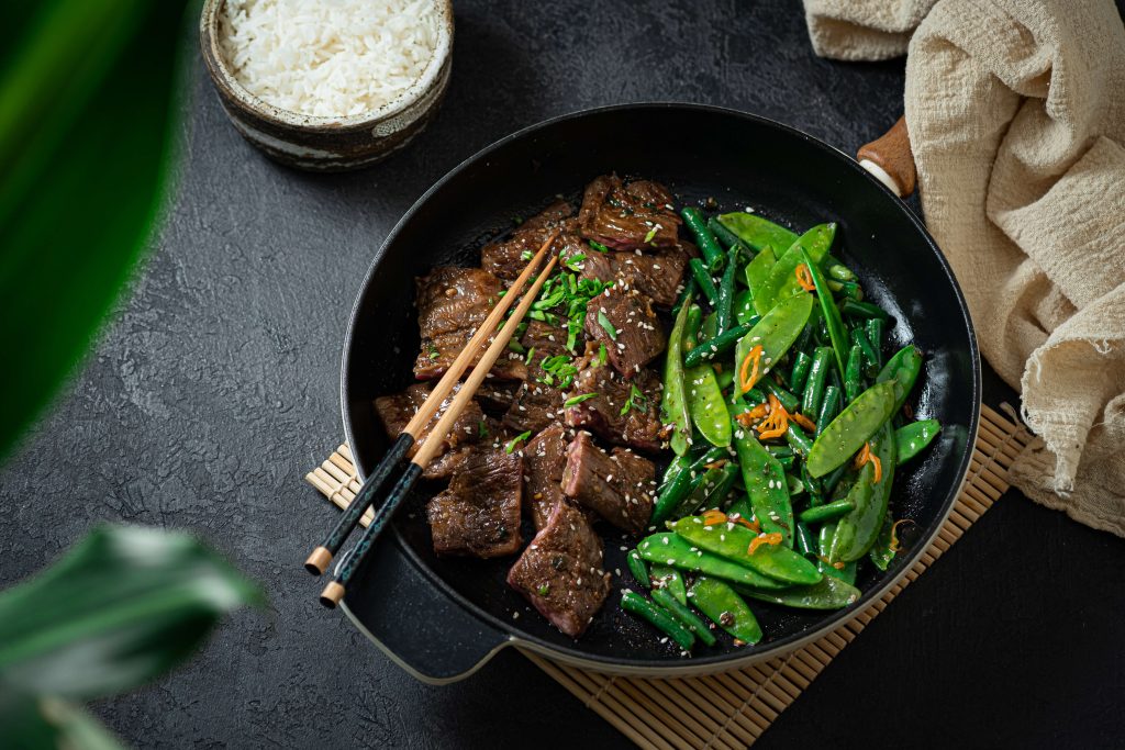 bowl with korean beef bulgogi and snap peas