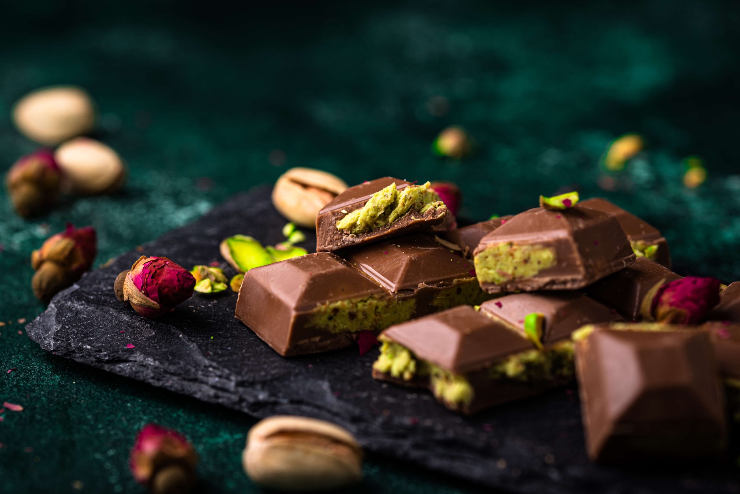 Chocolate squares with pistachio filling and nuts, celebrating global chocolate traditions